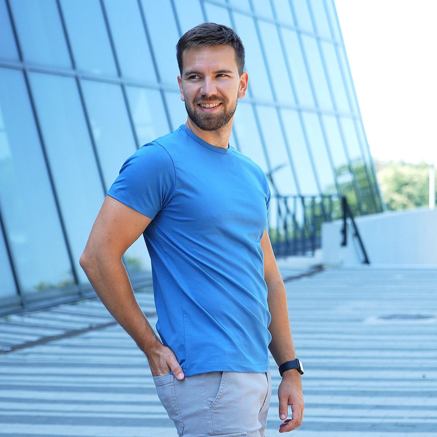 Model wearing a denim blue Giza Egyptian cotton t-shirt with a tailored fit by Intersect Collection