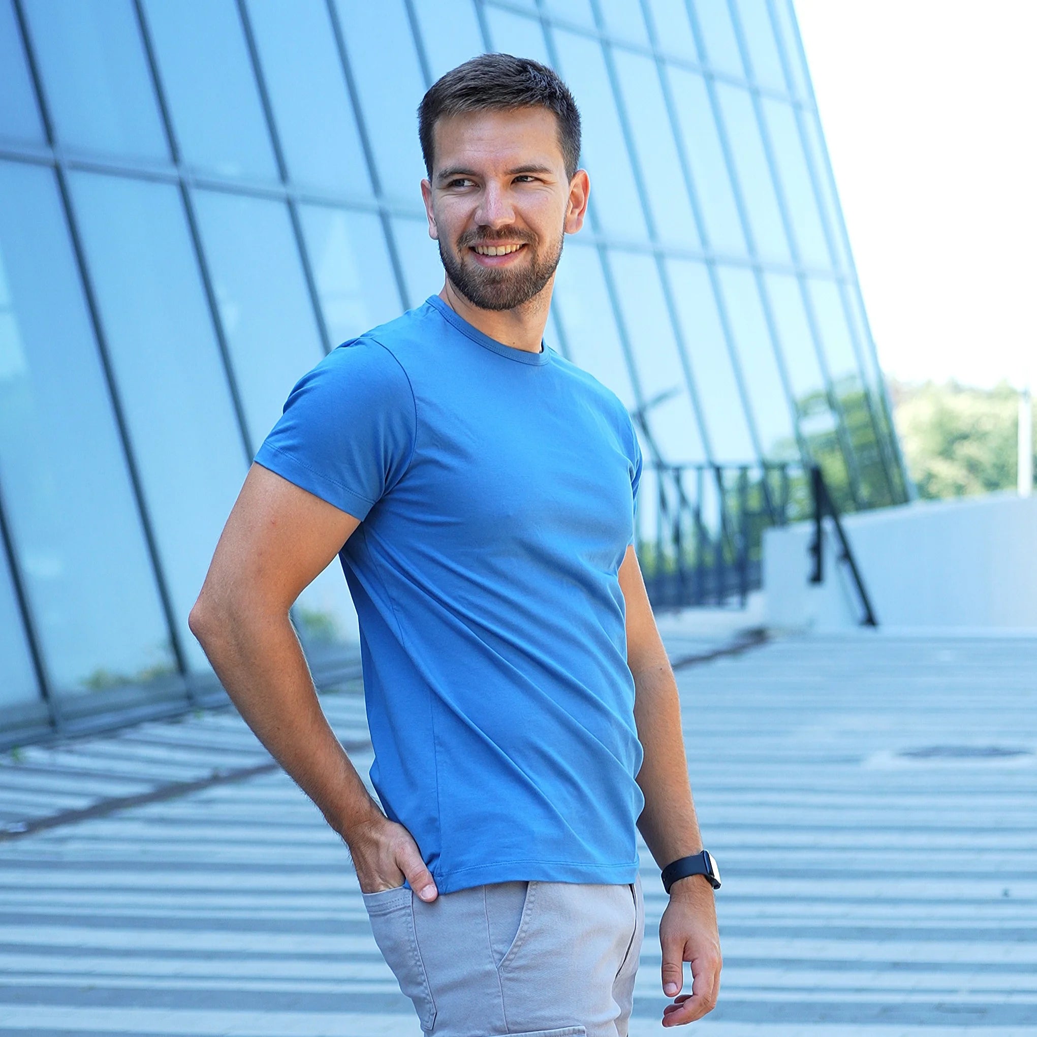 Model wearing a denim blue Giza Egyptian cotton t-shirt with a tailored fit by Intersect Collection