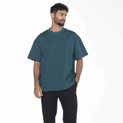 Model wearing a vintage blue Egyptian cotton drop shoulder tee