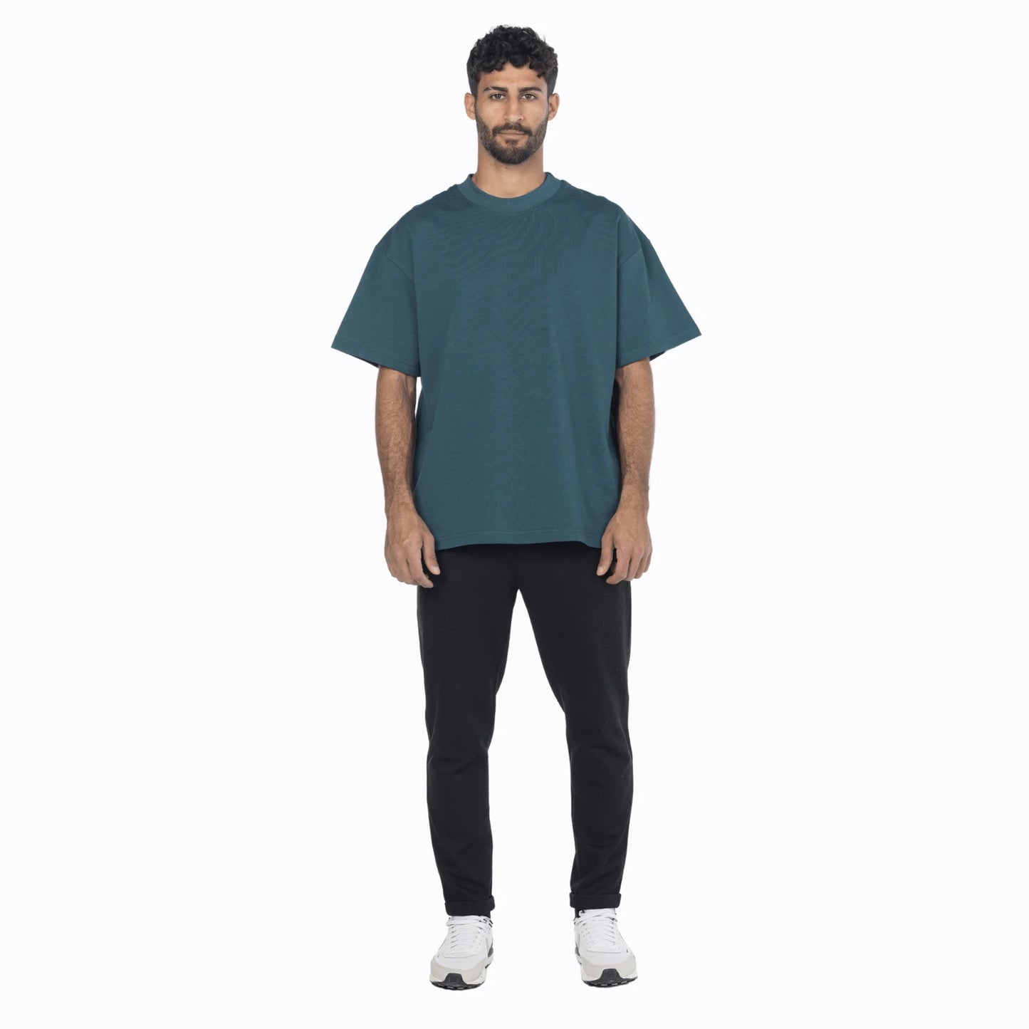 Model wearing a vintage blue premium cotton oversized fit tee