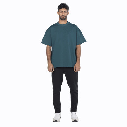 Model wearing a vintage blue premium cotton oversized fit tee