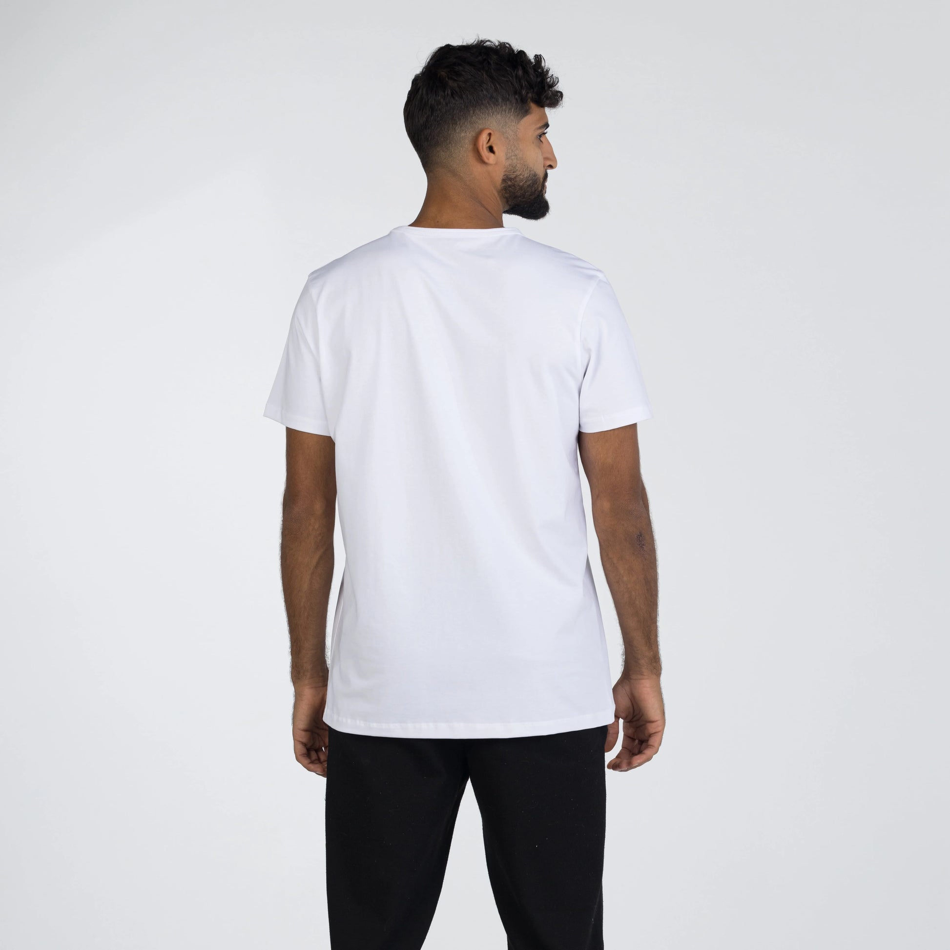 Model wearing a white Giza Egyptian cotton shirt with a tailored fit by Intersect Collection