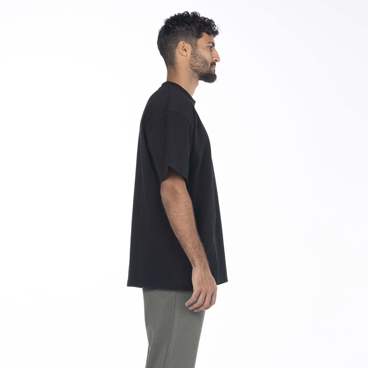 Model wearing a black Giza Egyptian cotton shirt with a drop shoulder fit by Intersect Collection