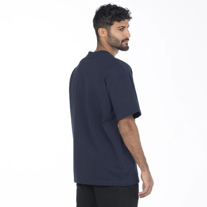 Male model wearing navy tee from Intersect Collection